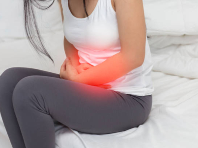 stomachache in young Asian woman